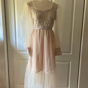 Beautiful Princess style blush color gown with sheer sleeves